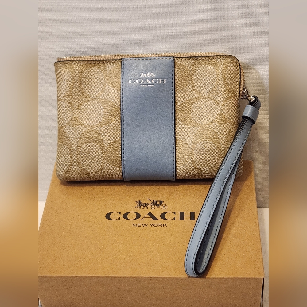 Coach Wristlet. 6x4". Coach pattern brown with blue lining.